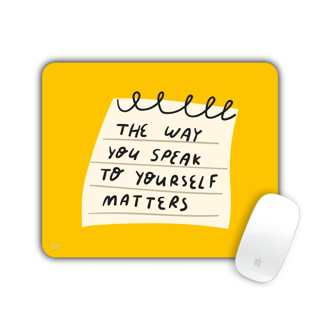 Notepad note reading 'The way you speak to yourself matters' on a yellow background mouse pad 23x19