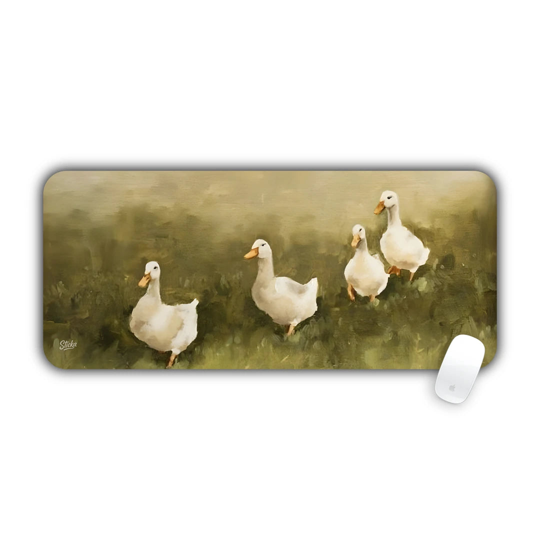 Oil painting of white domestic ducks walking across a lush green meadow desk pad 70x30