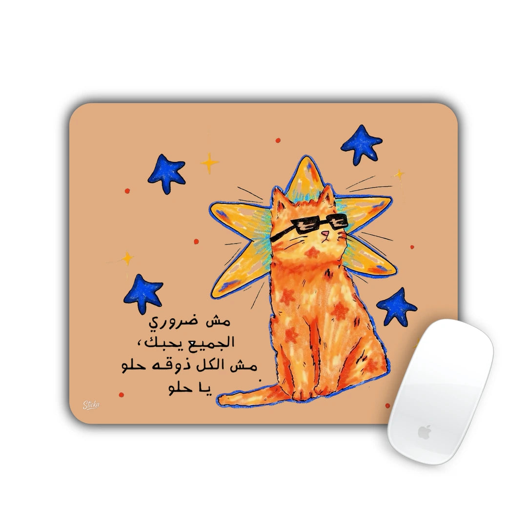 Orange cat in sunglasses with blue stars and an Arabic funny quote on peach mouse pad 23x19
