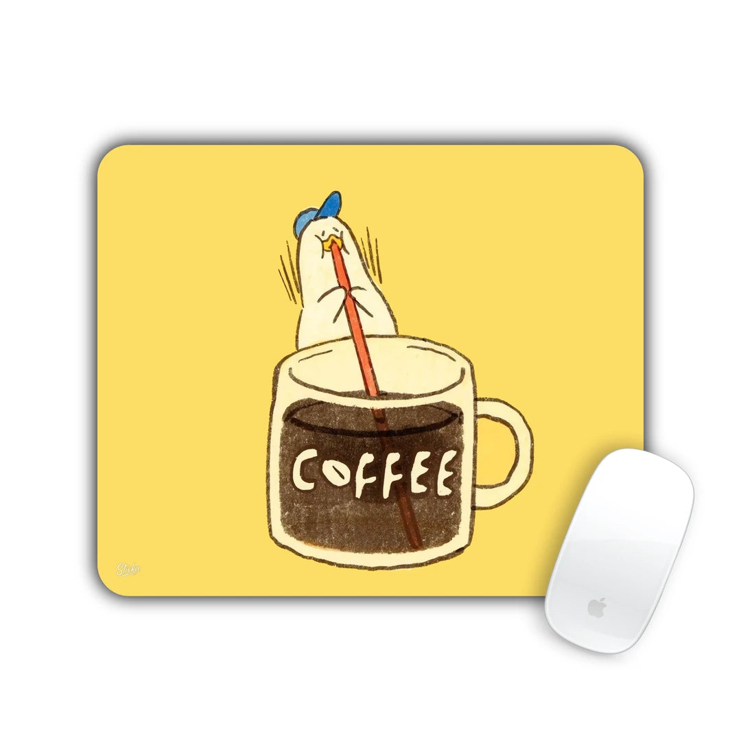 Duck diving head-first into a coffee mug on yellow mouse pad 23x19