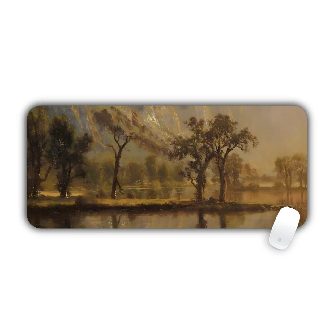 Romantic landscape painting of trees by a calm lake in golden light desk pad 70x30