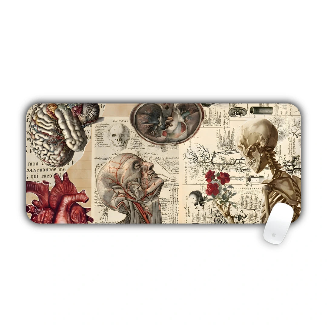 Old anatomy book pages with heart, skeleton and head drawings desk pad 70x30