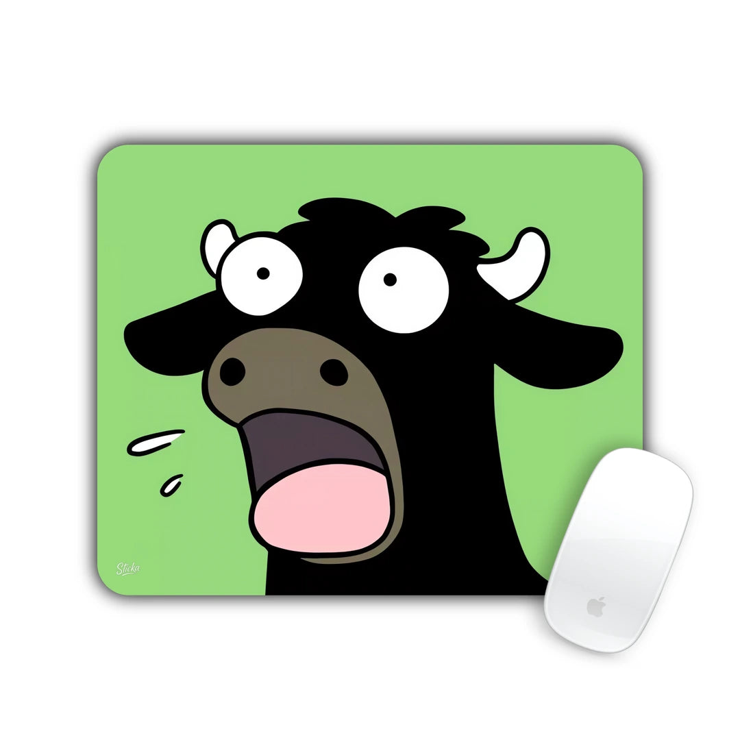 Black and white cartoon cow with mouth wide open on green mouse pad 23x19