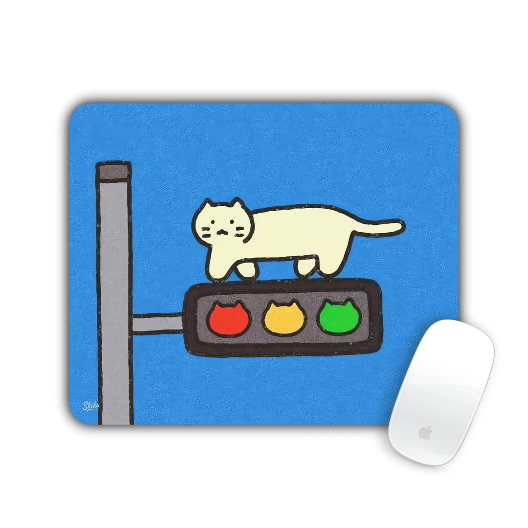 Cream cat lying on top of a traffic light on a blue background mouse pad 23x19
