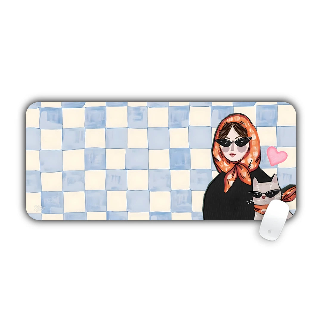 Watercolor blue checkered background with a woman in sunglasses holding a cat desk pad 70x30