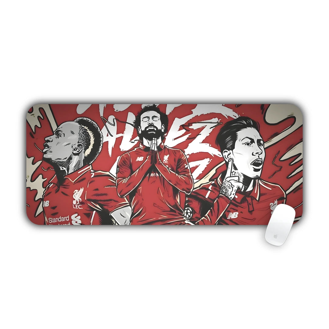 Illustrated three football players in red kits celebrating desk pad 70x30