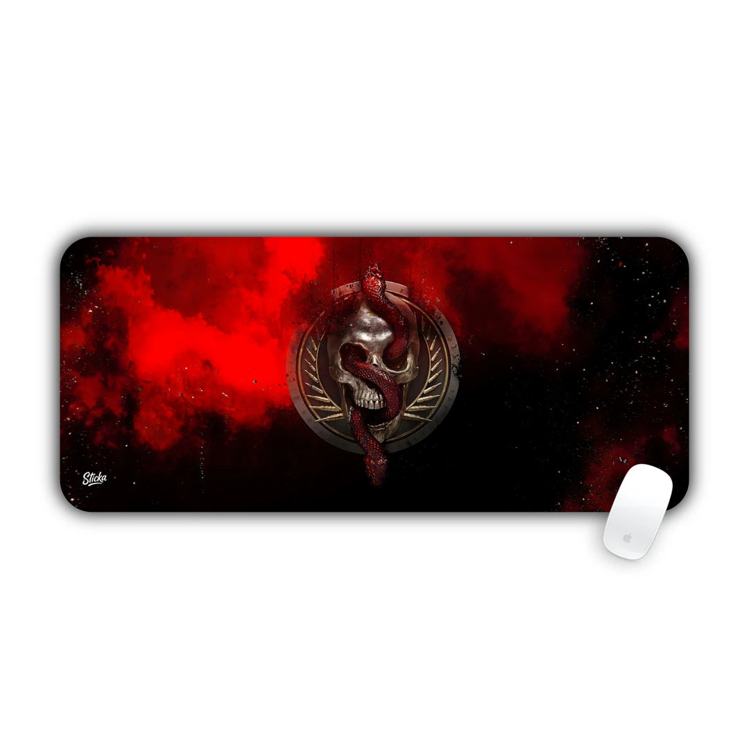 Metallic skull and serpent emblem with wings on a black background with red smoke desk pad 70x30