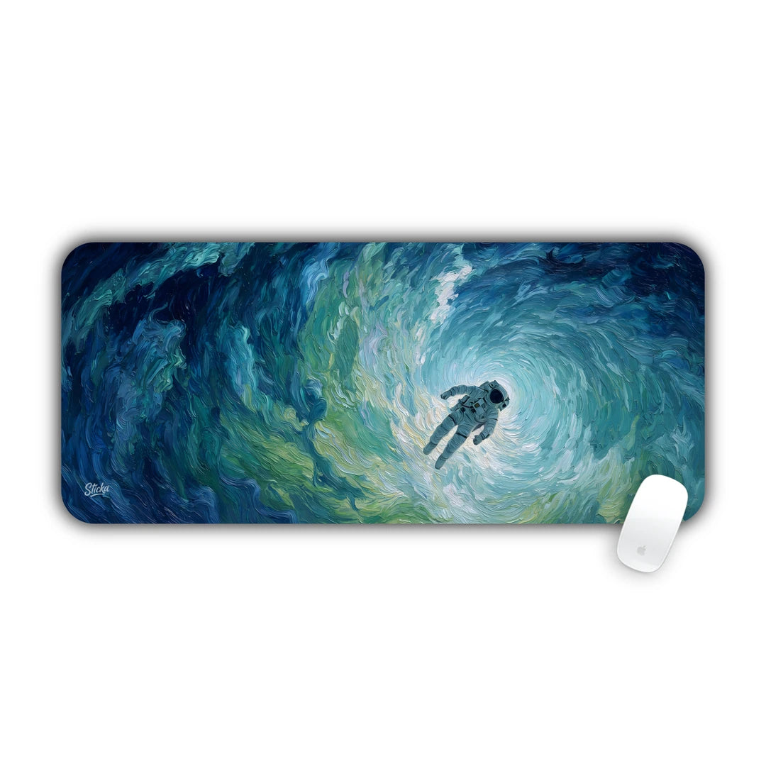 Astronaut floating inside a swirling turquoise blue cosmic vortex desk pad 70x30