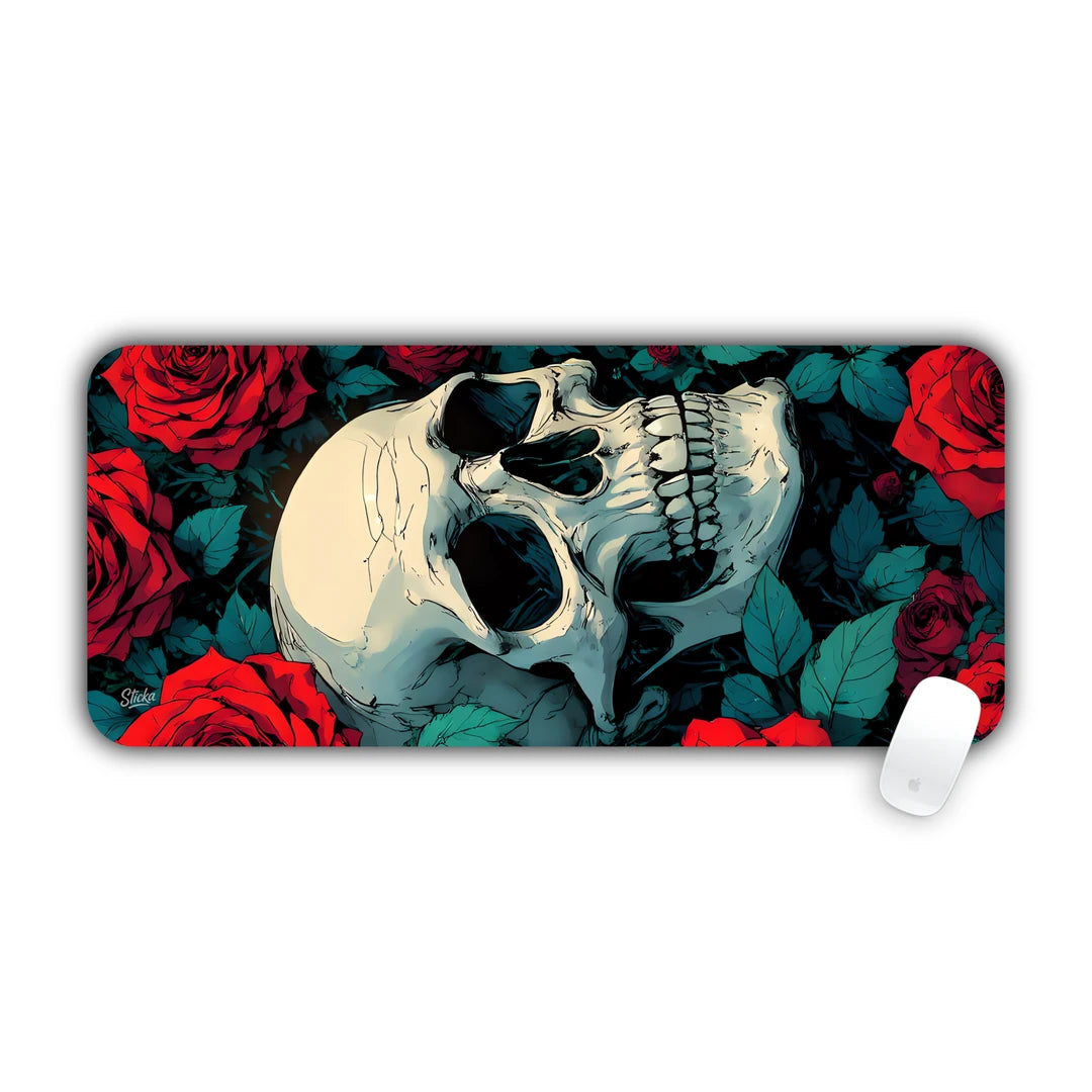 Realistic human skull surrounded by deep red roses and green leaves desk pad 70x30