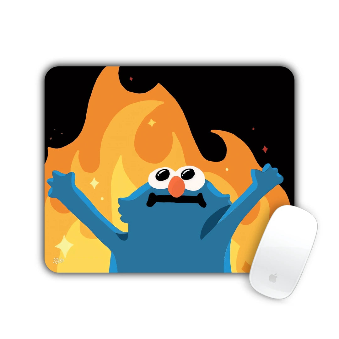 Blue furry monster with arms up in front of orange flames mouse pad 23x19