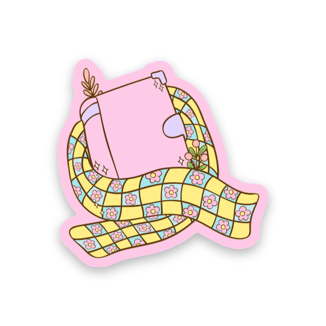 Pastel pink journal wrapped with a cozy checkered winter scarf sticker sticker