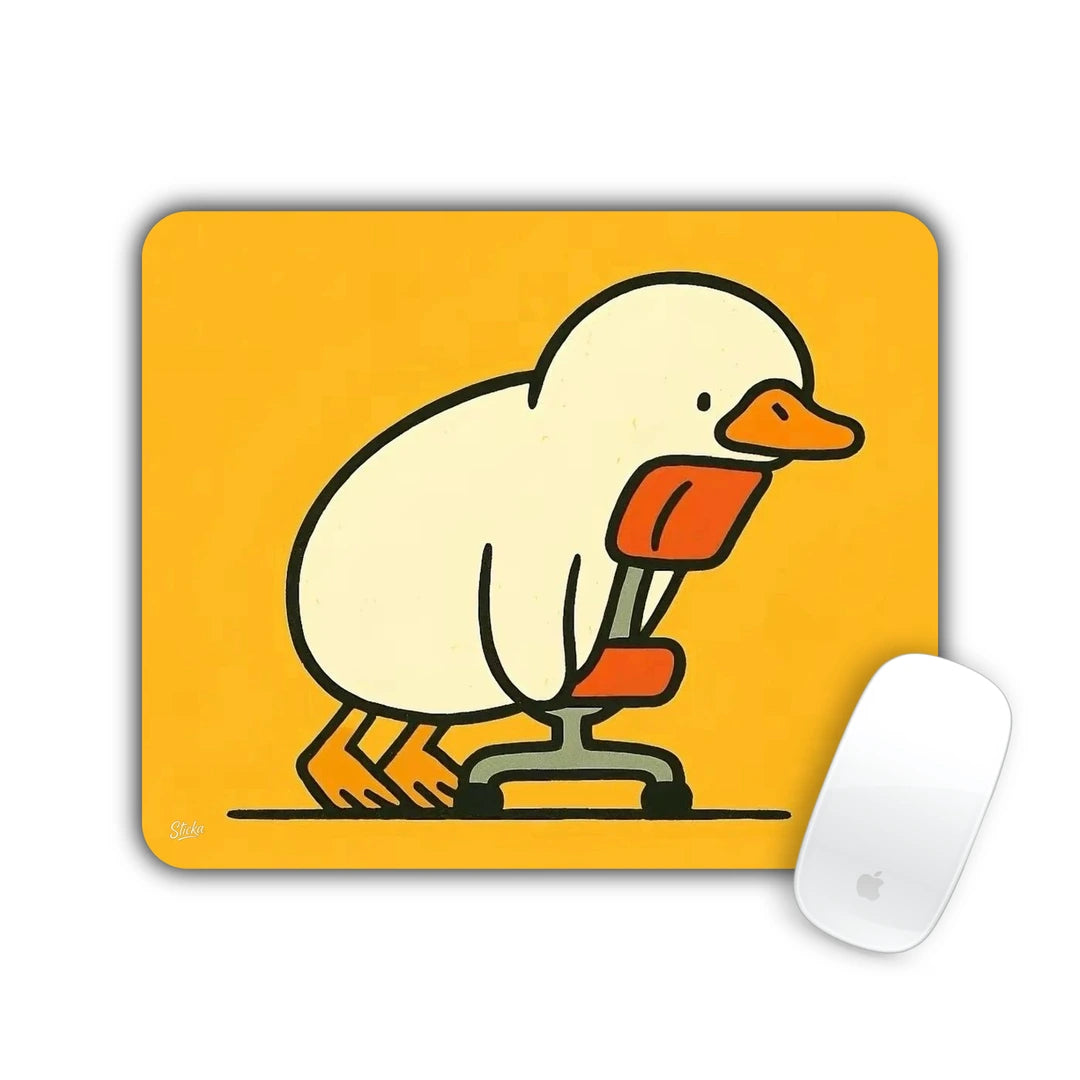 Cartoon duck awkwardly perched on a small orange office chair on a yellow background mouse pad 23x19