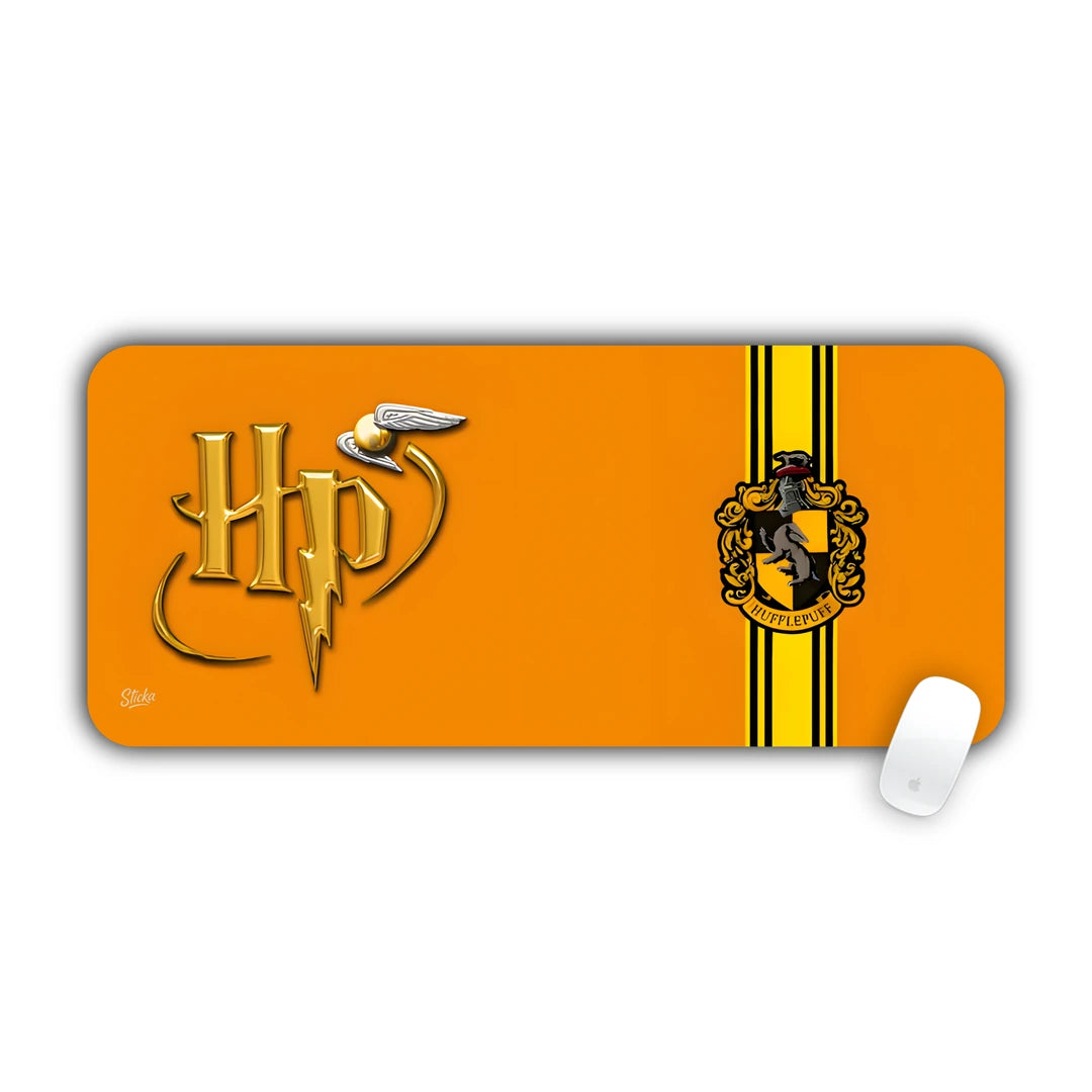 Harry Potter Hufflepuff house crest and HP logo on golden yellow background desk pad 70x30