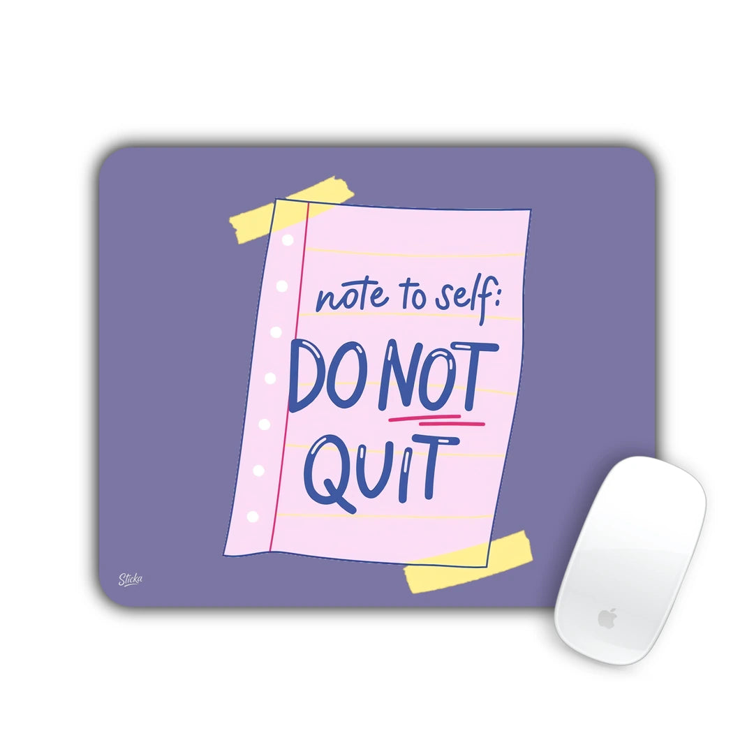 Taped pink note reading 'note to self: DO NOT QUIT' on a purple background mouse pad 23x19