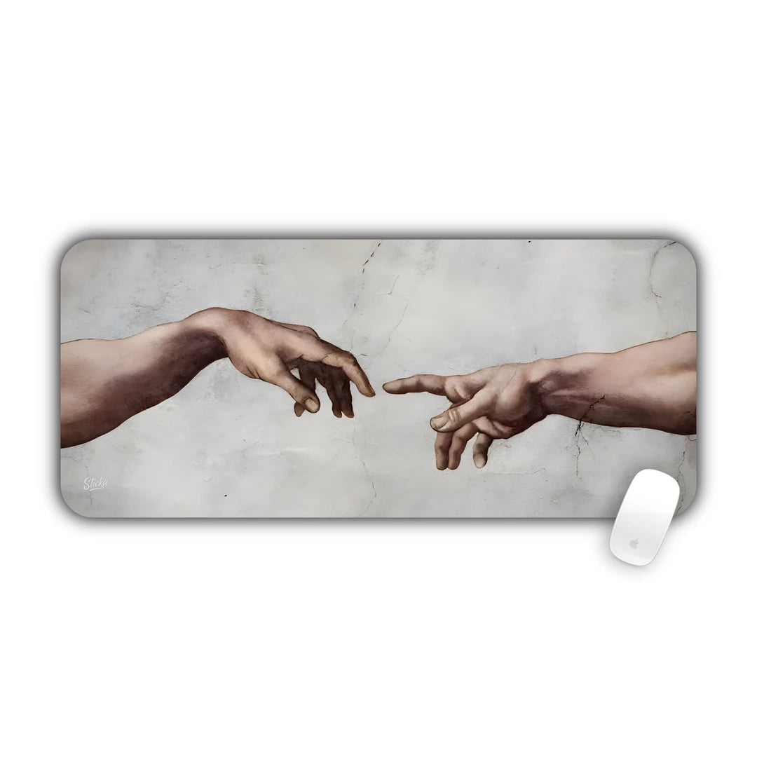 Detail of God and Adam's reaching hands from Michelangelo's Creation of Adam on aged plaster desk pad 70x30