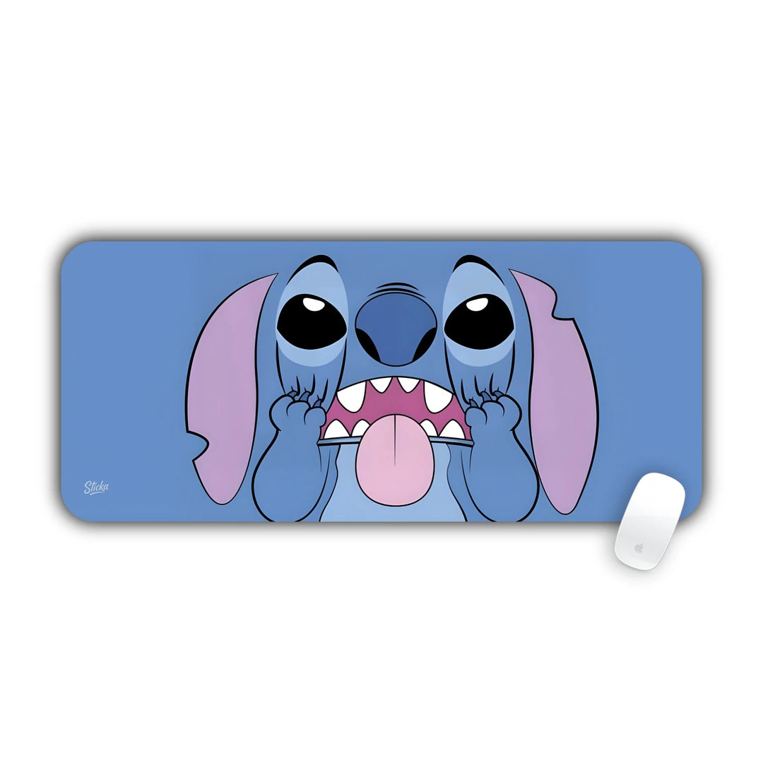 Stitch making a funny face sticking his tongue out on light blue desk pad 70x30