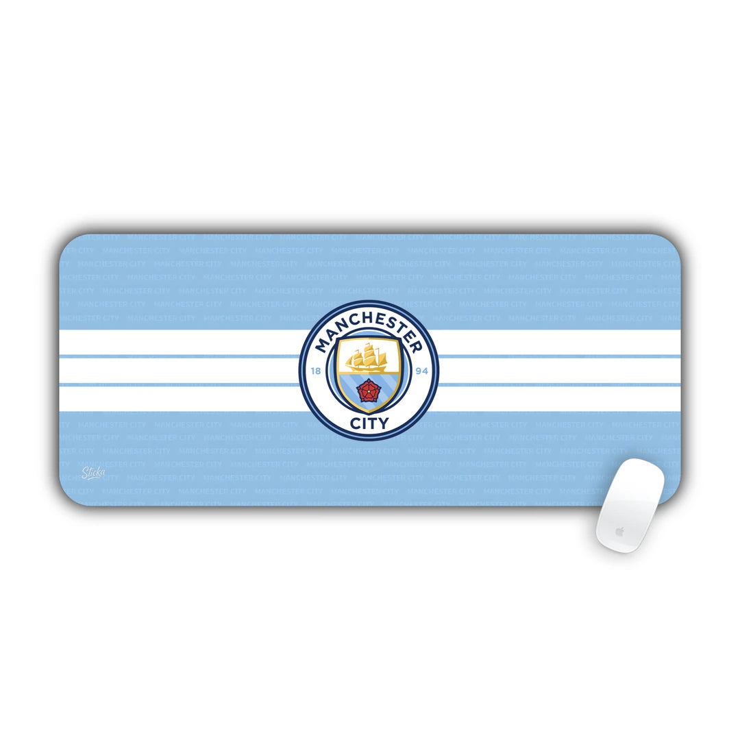 Manchester City football club crest centered on sky blue and white stripes desk pad 70x30