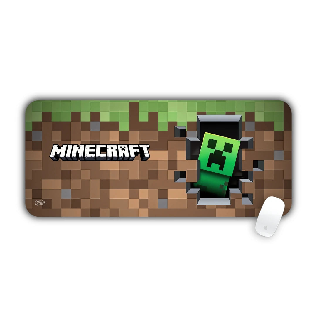 Minecraft logo with green Creeper peeking out of a broken stone wall desk pad 70x30
