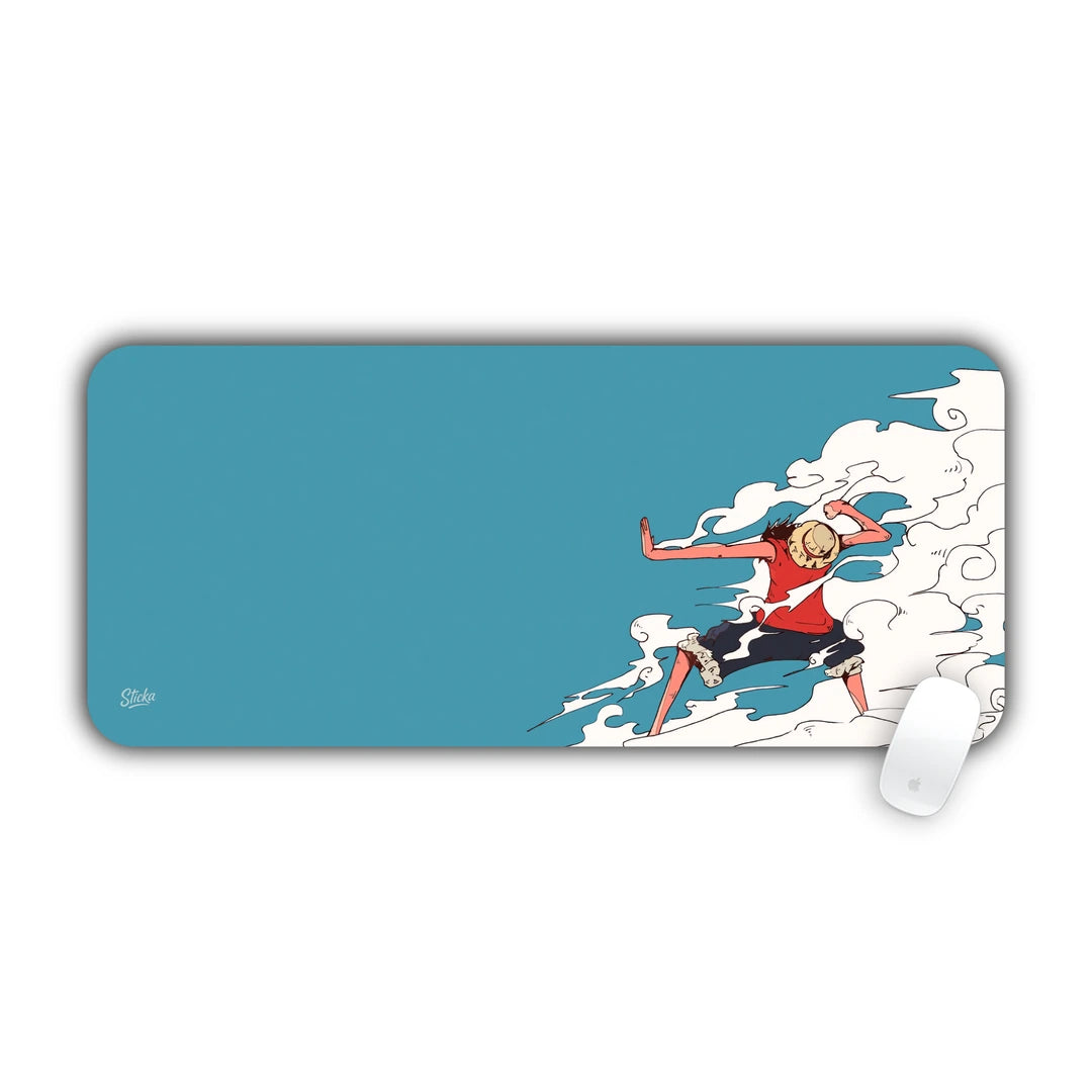 Luffy in Gear Second battle pose surrounded by steam smoke on clean blue desk pad 70x30