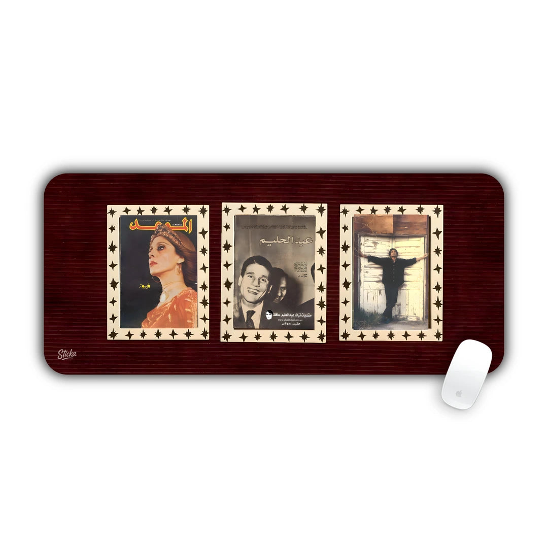 Three vintage framed black and white portraits on a dark red background desk pad 70x30