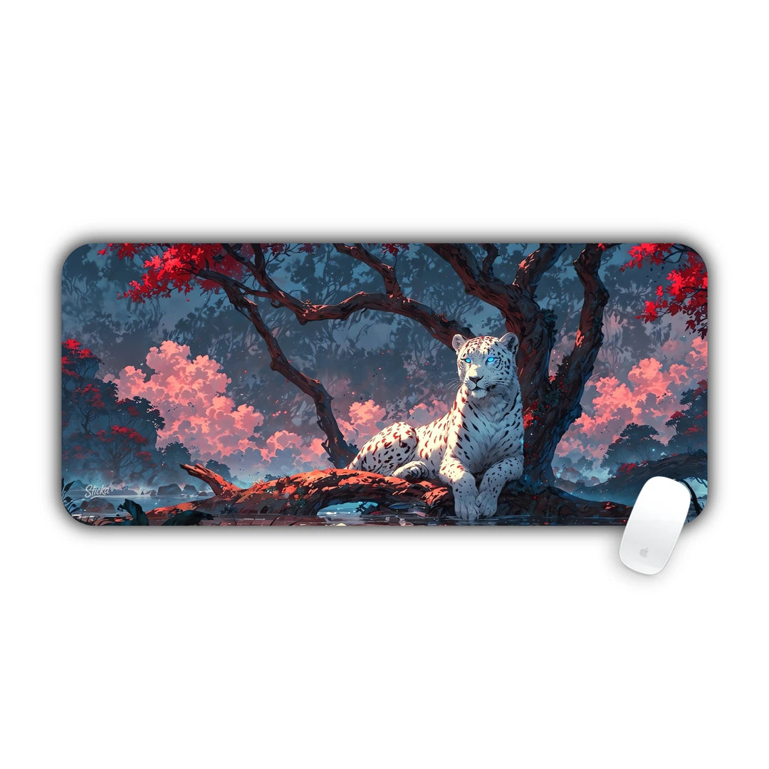 White leopard resting on a tree branch among pink cherry blossom trees desk pad 70x30