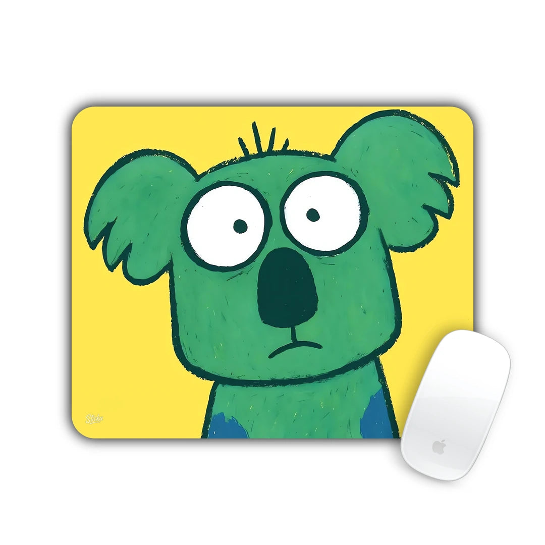 Green cartoon koala with a worried look on yellow mouse pad 23x19