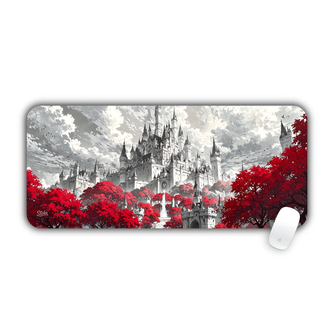 Grand white castle on a mountain cliff surrounded by striking red autumn foliage desk pad 70x30