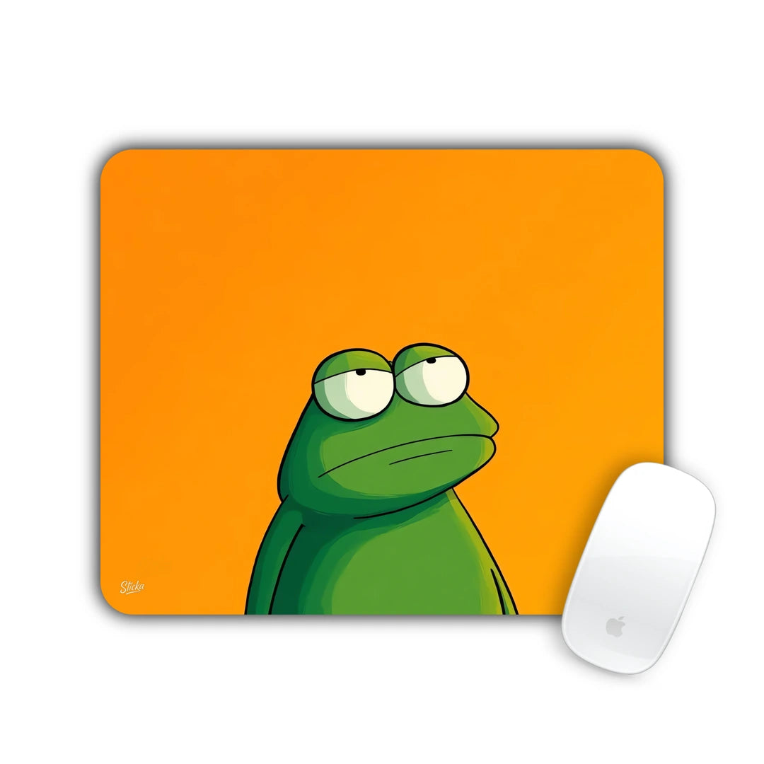 Green frog with a skeptical side look on orange mouse pad 23x19