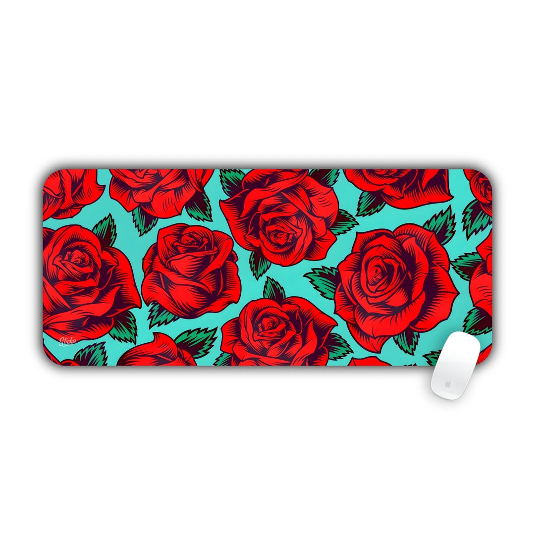 Repeated pattern of blooming red roses on a vibrant turquoise teal background desk pad 70x30